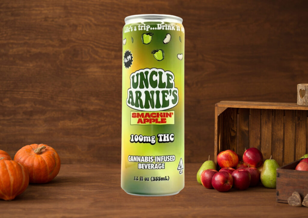 Uncle Arnie’s Smackin’ Apple cannabis beverage can displayed with pumpkins, apples, and pears